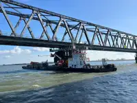 Multicat multipurpose vessel with hydraulic crane & spud pole legs