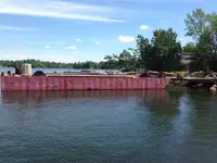 1990 60’ x 16’ x 6’ Steel Deck Barge with Ramps, Spud wells and Spuds