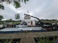 Multicat multipurpose vessel with hydraulic crane & spud pole legs